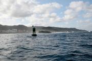 Camelle.Boya verde bajo Pedra do Porto que esta enfilado al NNE con el espigón.